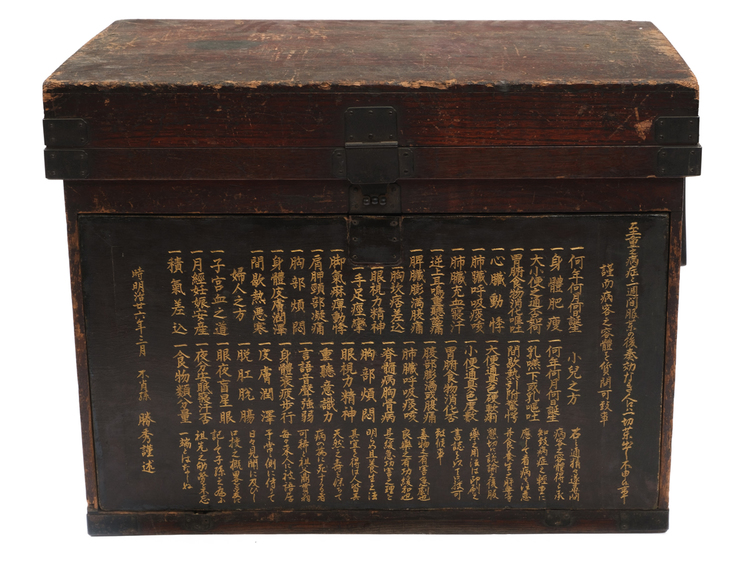 A rare and large Japanese wooden box with four drawers behind a separate board