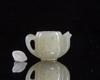 A Chinese jade miniature teapot. and cover