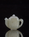 A Chinese jade miniature teapot. and cover
