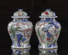 A pair of Chinese wucai glazed pots and covers