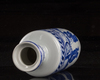 A small Chinese blue and white 'figural' rouleau vase