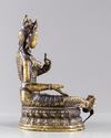 A Tibetan gilt bronze figure of the green Tara, Syamatara