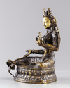 A Tibetan gilt bronze figure of the green Tara, Syamatara