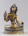 A Tibetan gilt bronze figure of the green Tara, Syamatara