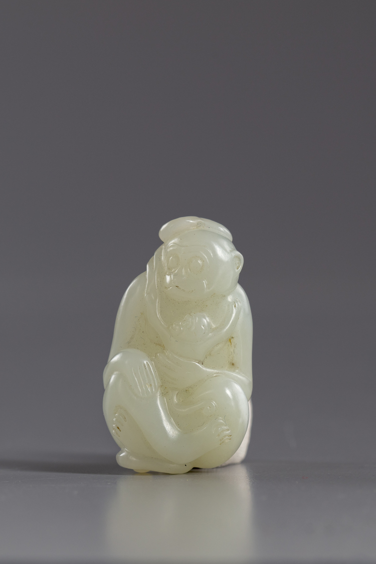 A Chinese jade carving of a monkey and young