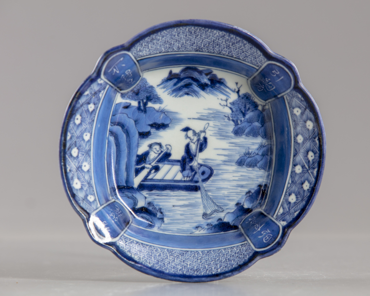 A Japanese blue and white dish A JAPANESE BLUE AND WHITE DISH , 19TH CENTRUY