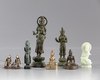 A group of five bronze and two jade figures