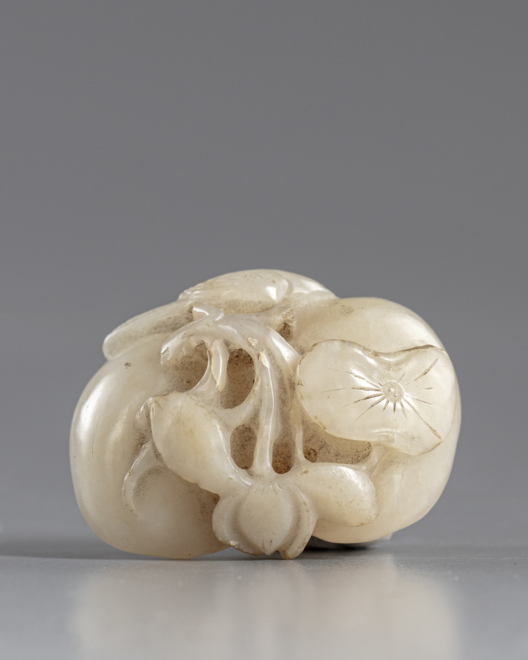 A CHINESE JADE LOTUS CARVING