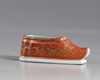 A  gilt Chinese porcelain shoe