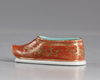 A  gilt Chinese porcelain shoe