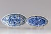 A Chinese blue and white teapot and two oval shaped trays