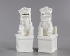 A PAIR OF CHINESE BLANC DE CHINE BUDDHIST LIONS