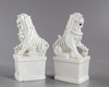 A PAIR OF CHINESE BLANC DE CHINE BUDDHIST LIONS