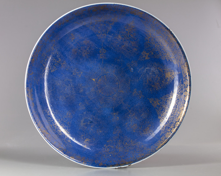 A LARGE CHINESE POWDER-BLUE GROUND GILT-DECORATED CHARGER KANGXI PERIOD (1662-1722)