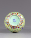 A Chinese famille rose lime green vase