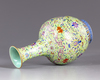 A Chinese famille rose lime green vase
