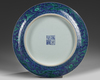 A Chinese blue ground green-enamelled 'dragon' charger