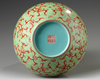 A Chinese lime green ground iron red decorated double gourd vase