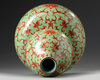 A Chinese lime green ground iron red decorated double gourd vase