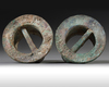 A pair of Chinese bronze axle caps