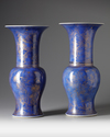 A pair of Chinese powder blue-ground gilt-decorated phoenix tail vases