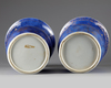 A pair of Chinese powder blue-ground gilt-decorated phoenix tail vases