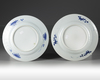 A pair of Chinese blue and white 'flower basket' dishes