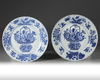 A pair of Chinese blue and white 'flower basket' dishes