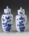 A pair of Chinese blue and white 'floral' vases and covers