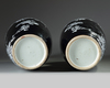 A pair of Chinese black-ground enamelled 'magpie and prunus' vases