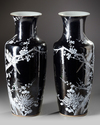 A pair of Chinese black-ground enamelled 'magpie and prunus' vases