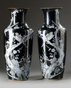 A pair of Chinese black-ground enamelled 'magpie and prunus' vases