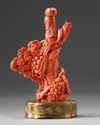 A Chinese red coral lady and boys carving