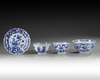 Three Chinese blue and white bowls and a dish