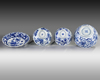 Three Chinese blue and white bowls and a dish