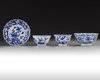 Three Chinese blue and white bowls and a dish