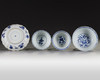 Three Chinese blue and white bowls and a dish