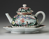 A CHINESE BLACK-GROUND FAMILLE ROSE TEAPOT, COVER AND STAND, YONGZHENG PERIOD (1723-1735)