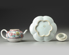 A CHINESE PINK-GROUND FAMILLE ROSE MOULDED 'CHRYSANTHEMUM' TEAPOT, COVER AND STAND