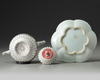 A CHINESE PINK-GROUND FAMILLE ROSE MOULDED 'CHRYSANTHEMUM' TEAPOT, COVER AND STAND