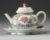 A CHINESE PINK-GROUND FAMILLE ROSE MOULDED 'CHRYSANTHEMUM' TEAPOT, COVER AND STAND