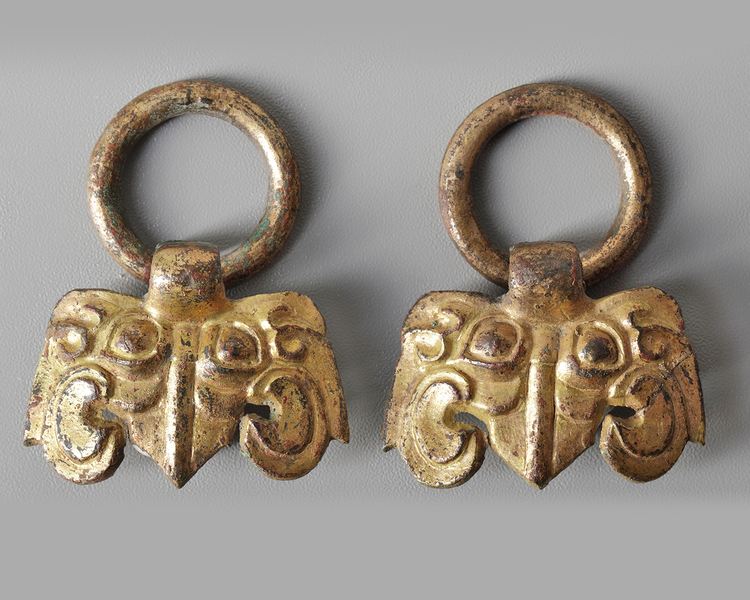Two Chinese gilt bronze taotie masks