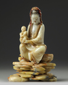 A Chinese soapstone Guanyin figure on stand