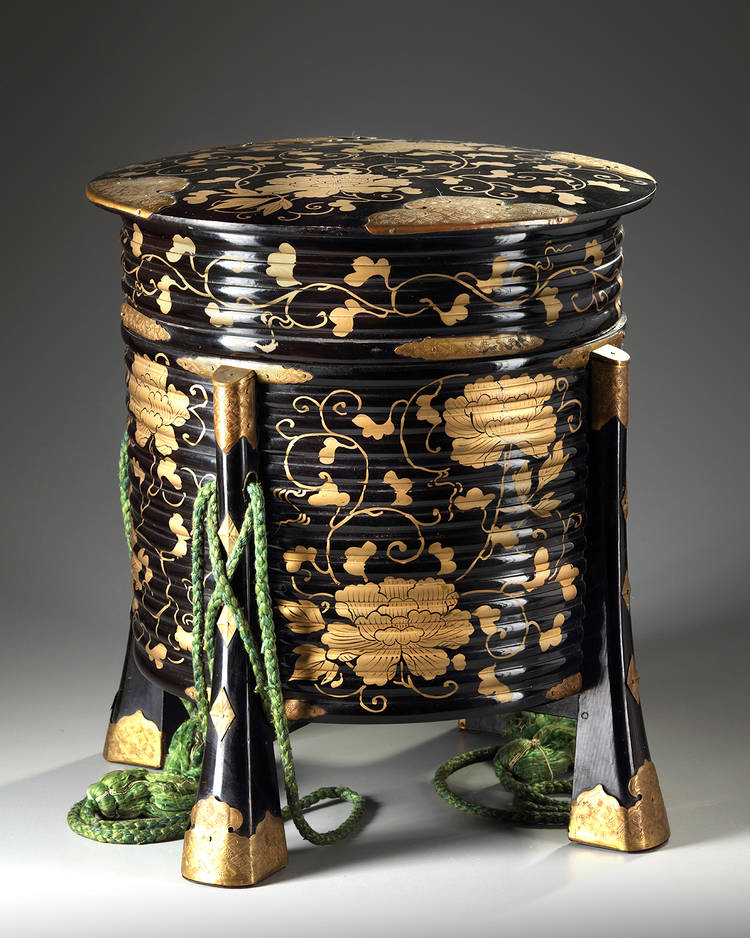 A Japanese black lacquered Hokai-box with gilded fittings.