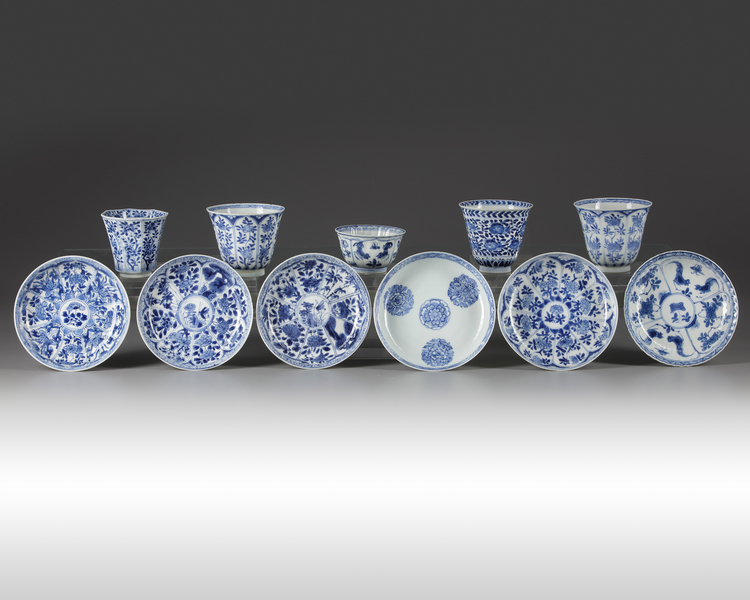 A group of eleven Chinese blue and white cups and saucers