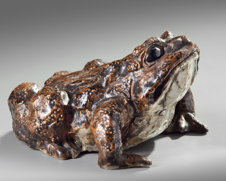 A Japanese ceramic figure of a frog