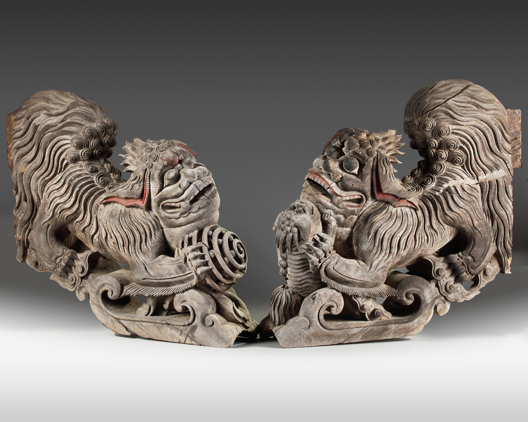 A rare set of two plain wooden corbels from Kyūshū with carved Chinese lions (karashishi)