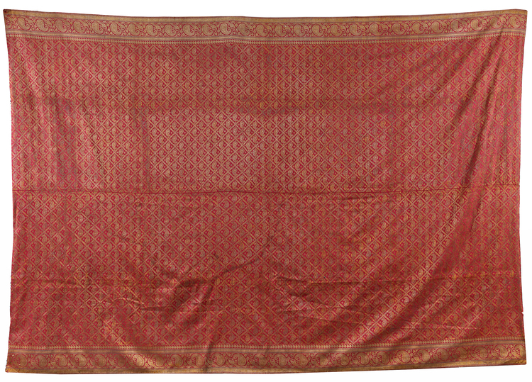 A LARGE EMBROIDERED DEEP RED BEDSHEET, INDIA,19TH CENTURY