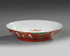 A Chinese coral-ground famille verte 'boys' dish