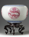 A pair of Chinese famille rose 'dragon' jardinieres